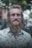 A man with a beard and a flowered shirt