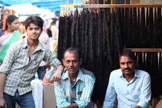 A group of men sitting next to each other