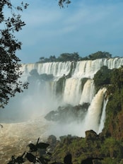 A large waterfall with water pouring out of it