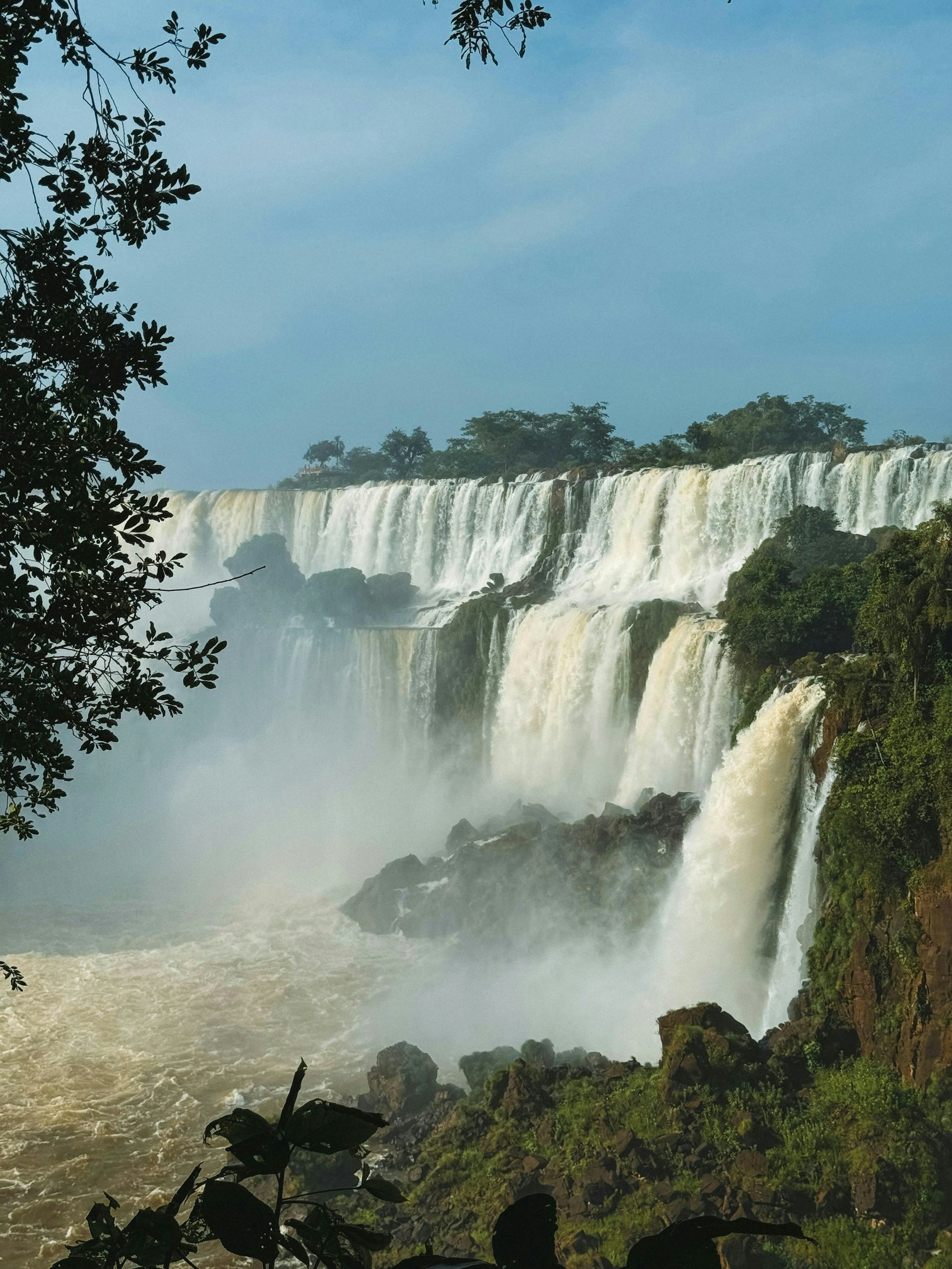 A large waterfall with water pouring out of it