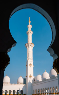 A large white building with a tall tower