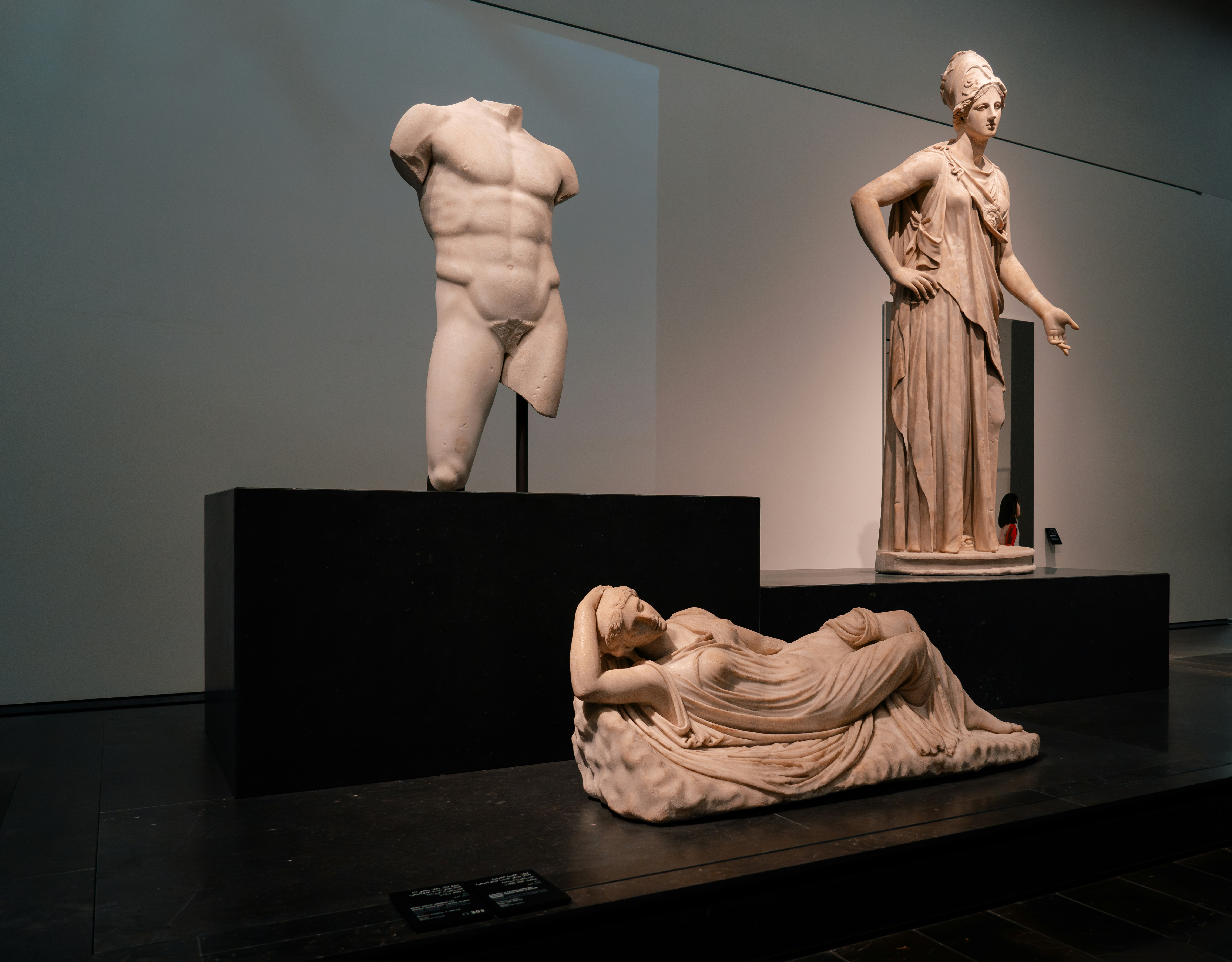 A group of statues sitting on top of a black table