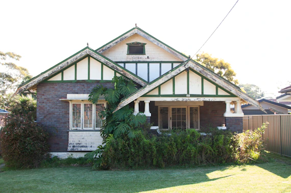 A house with a fence in front of it