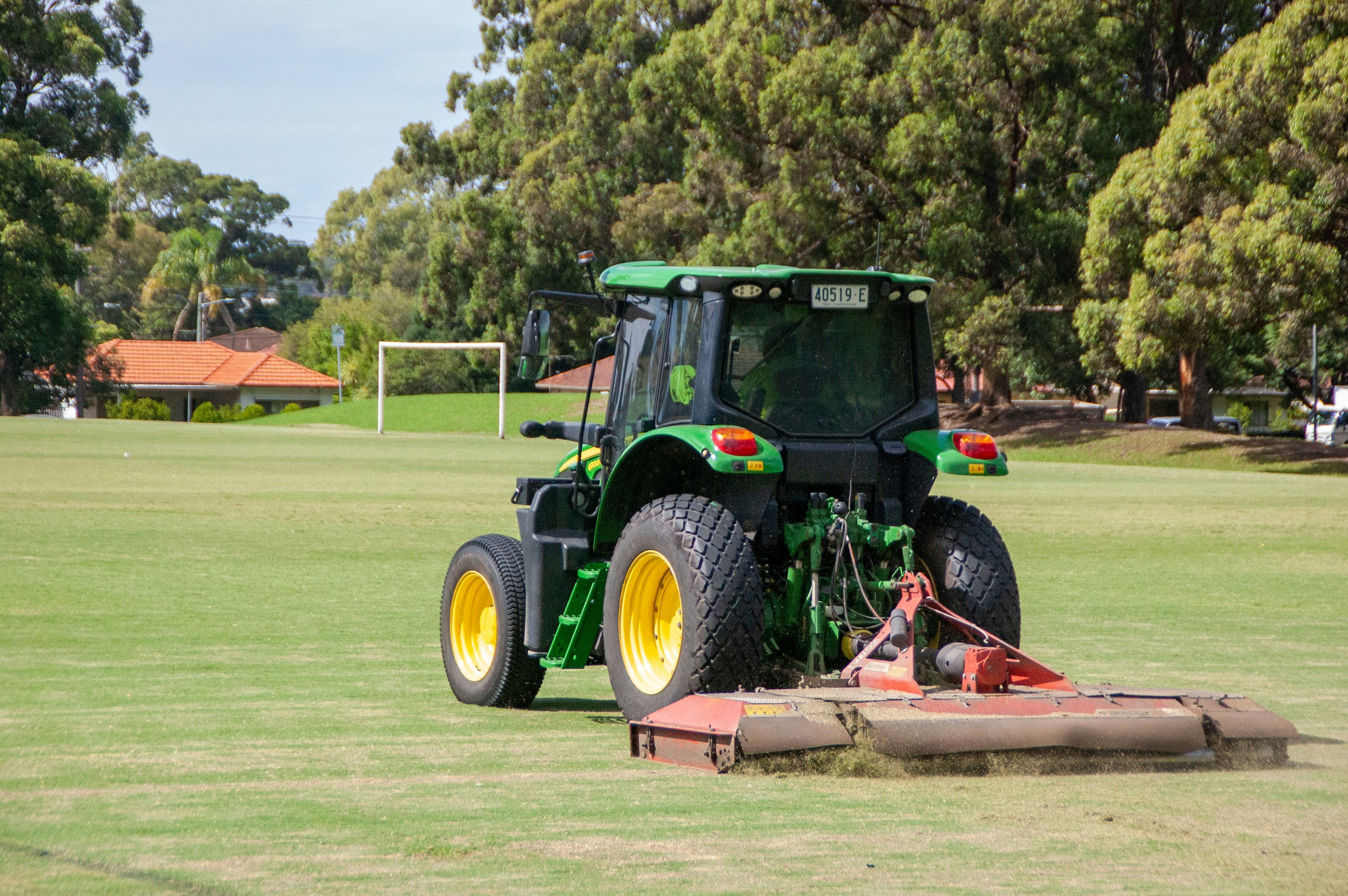 A tractor that is sitting in the grass