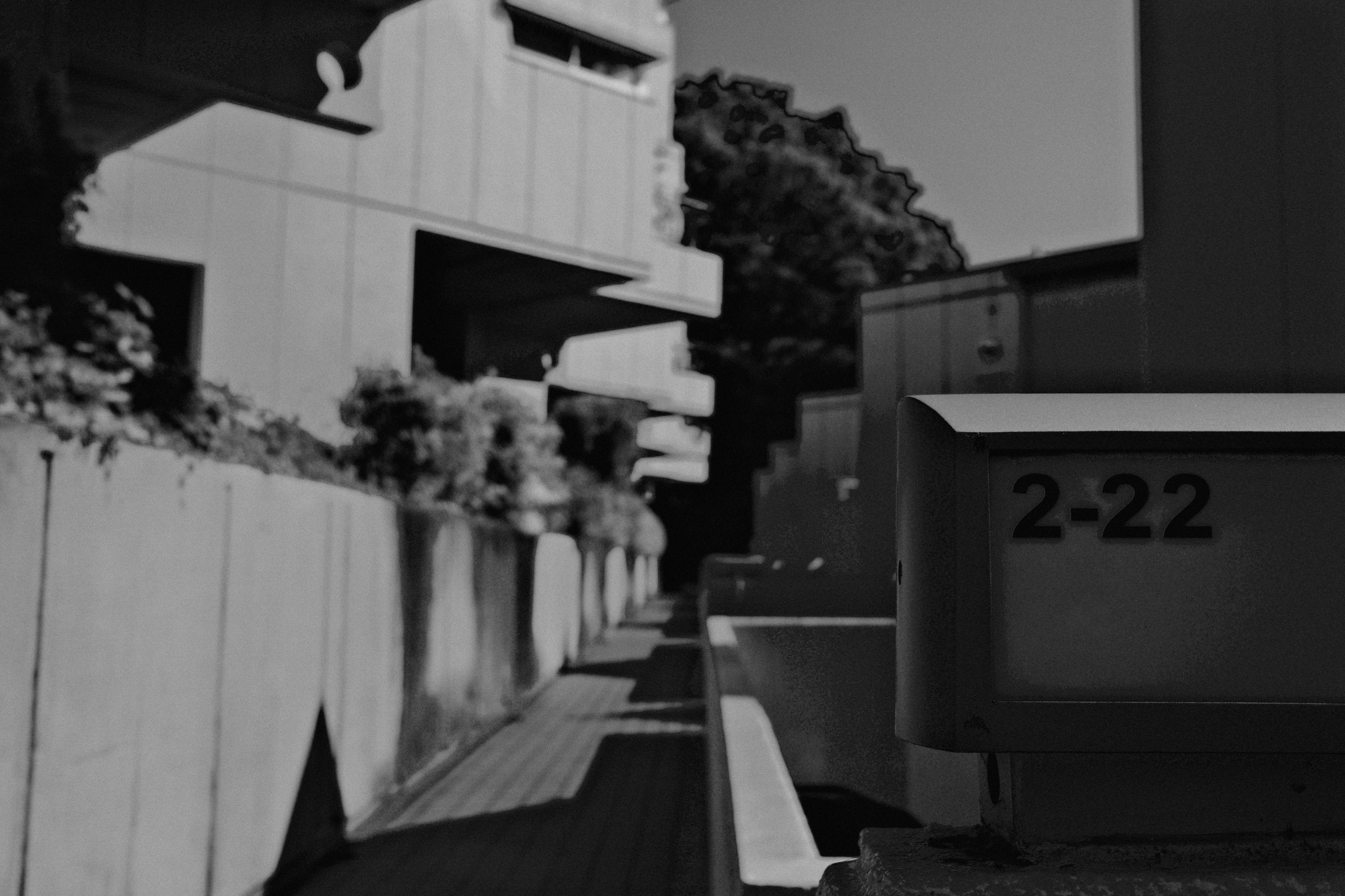 A black and white photo of a building and a street