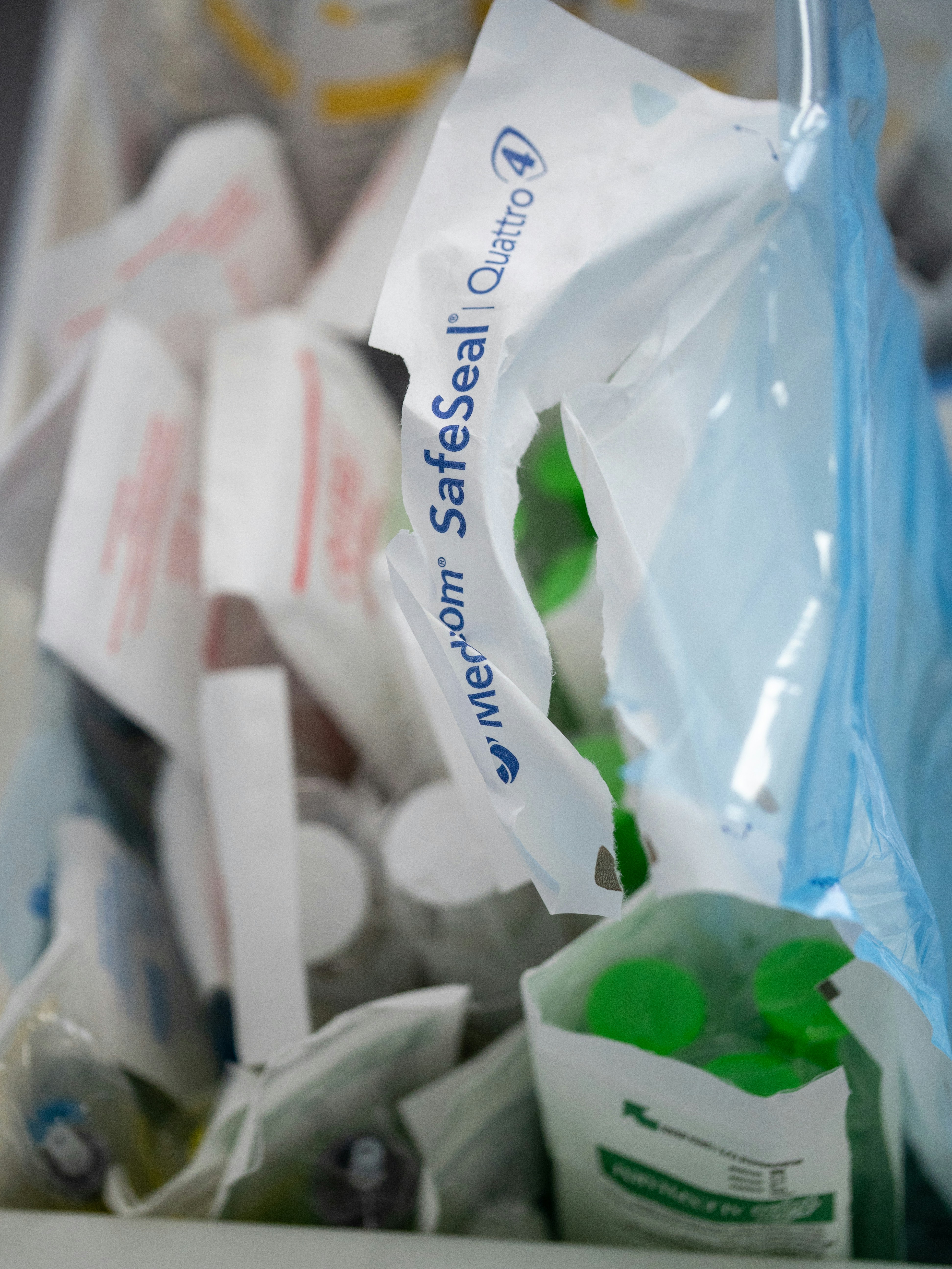 A bag of toothbrushes and toothpaste on a table