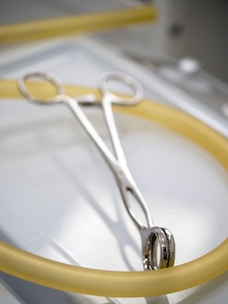 A pair of scissors sitting on top of a table