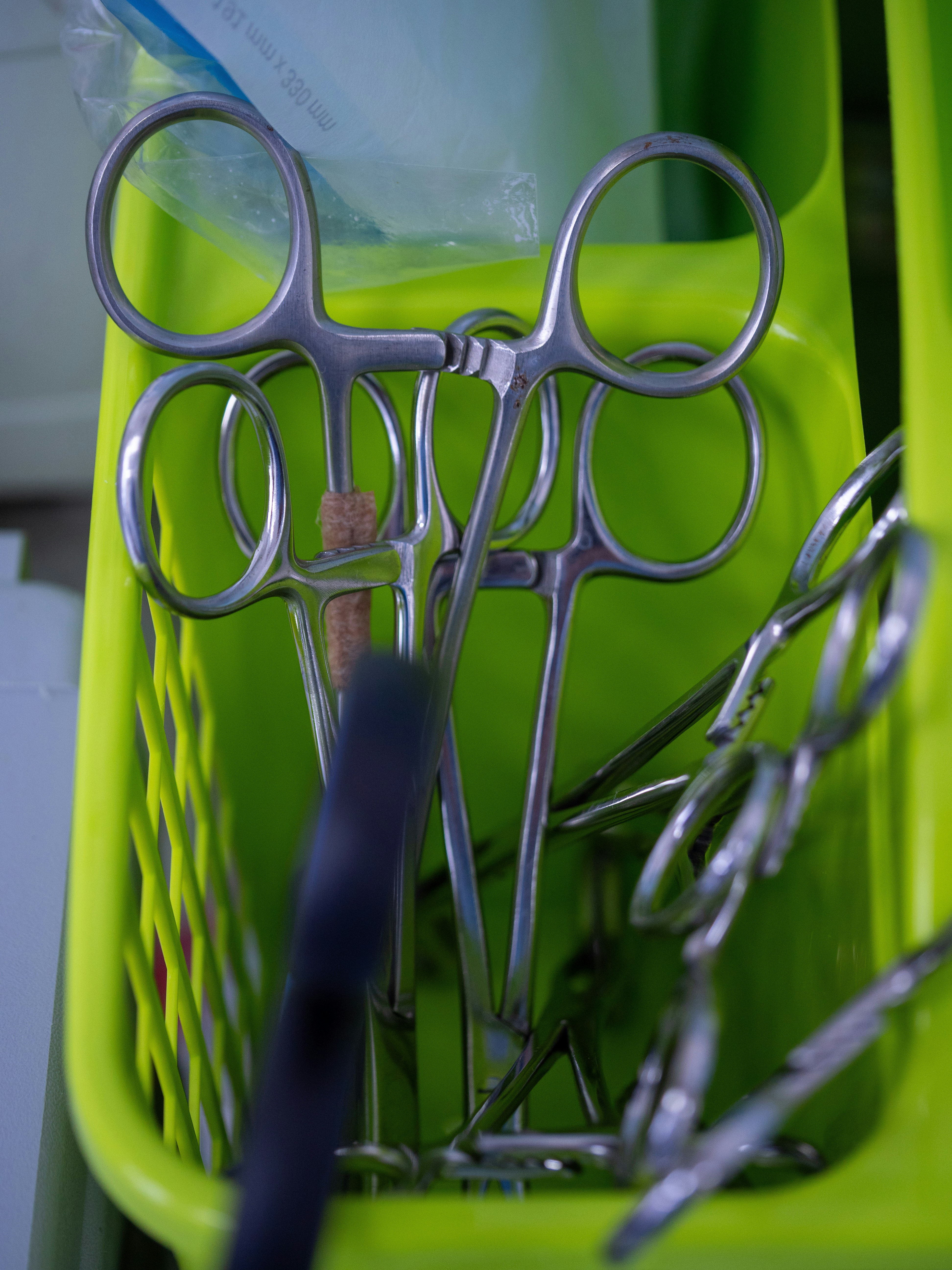 A close up of a basket with scissors in it