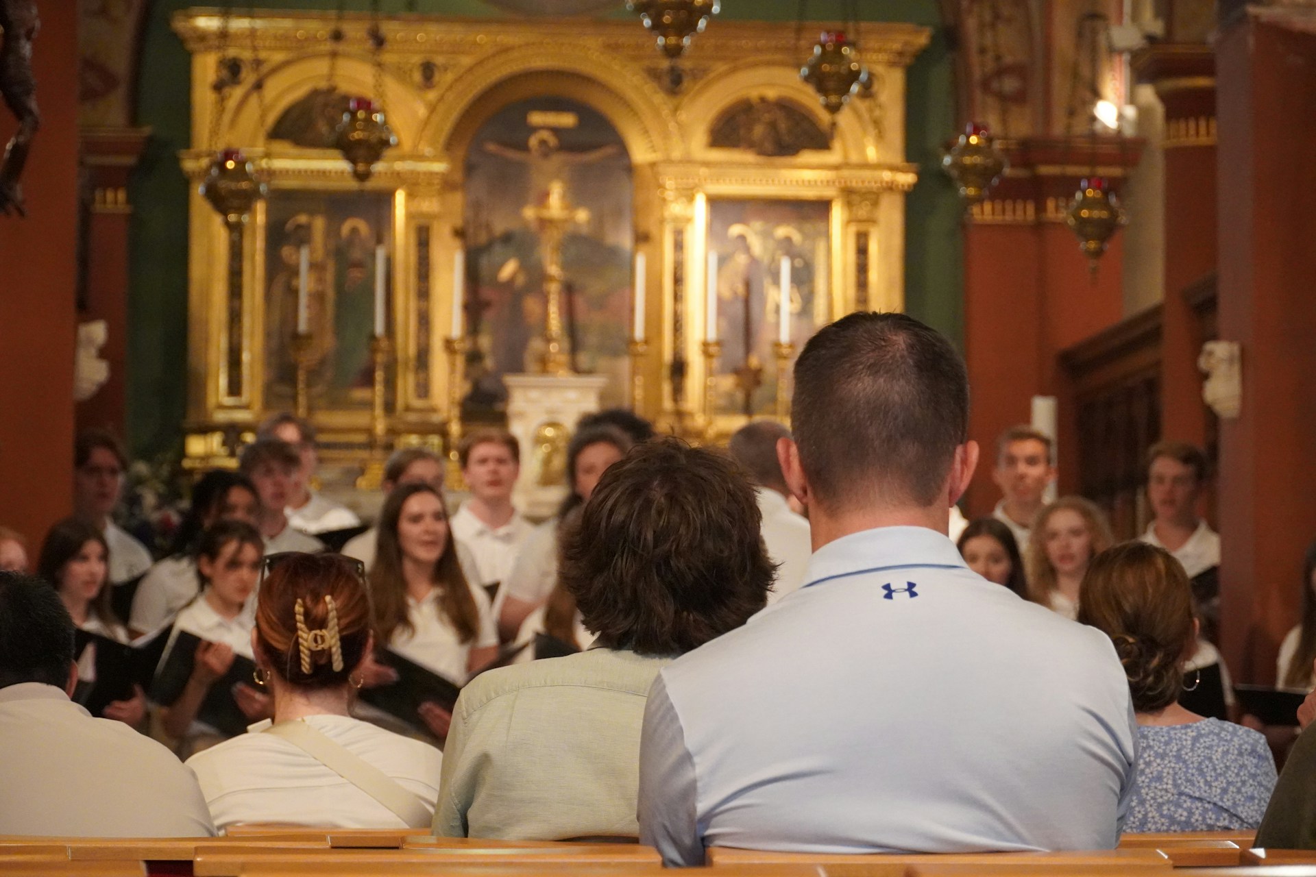 A group of people sitting in a church