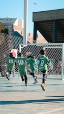 A group of young boys playing a game of soccer
