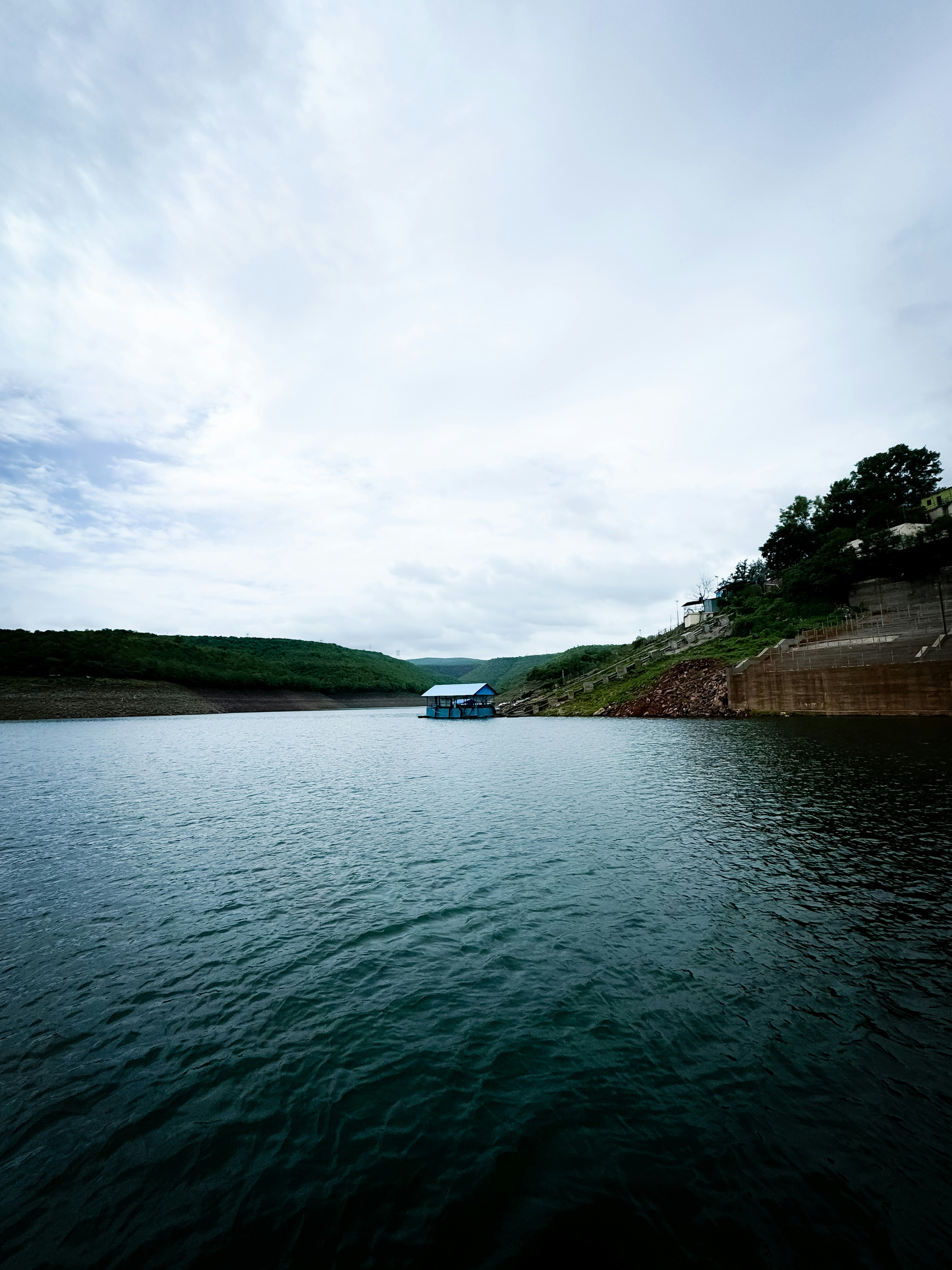 A body of water with a boat in the distance