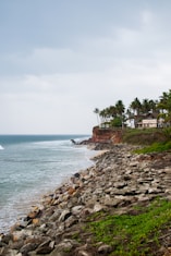 A view of a beach with a house on the shore