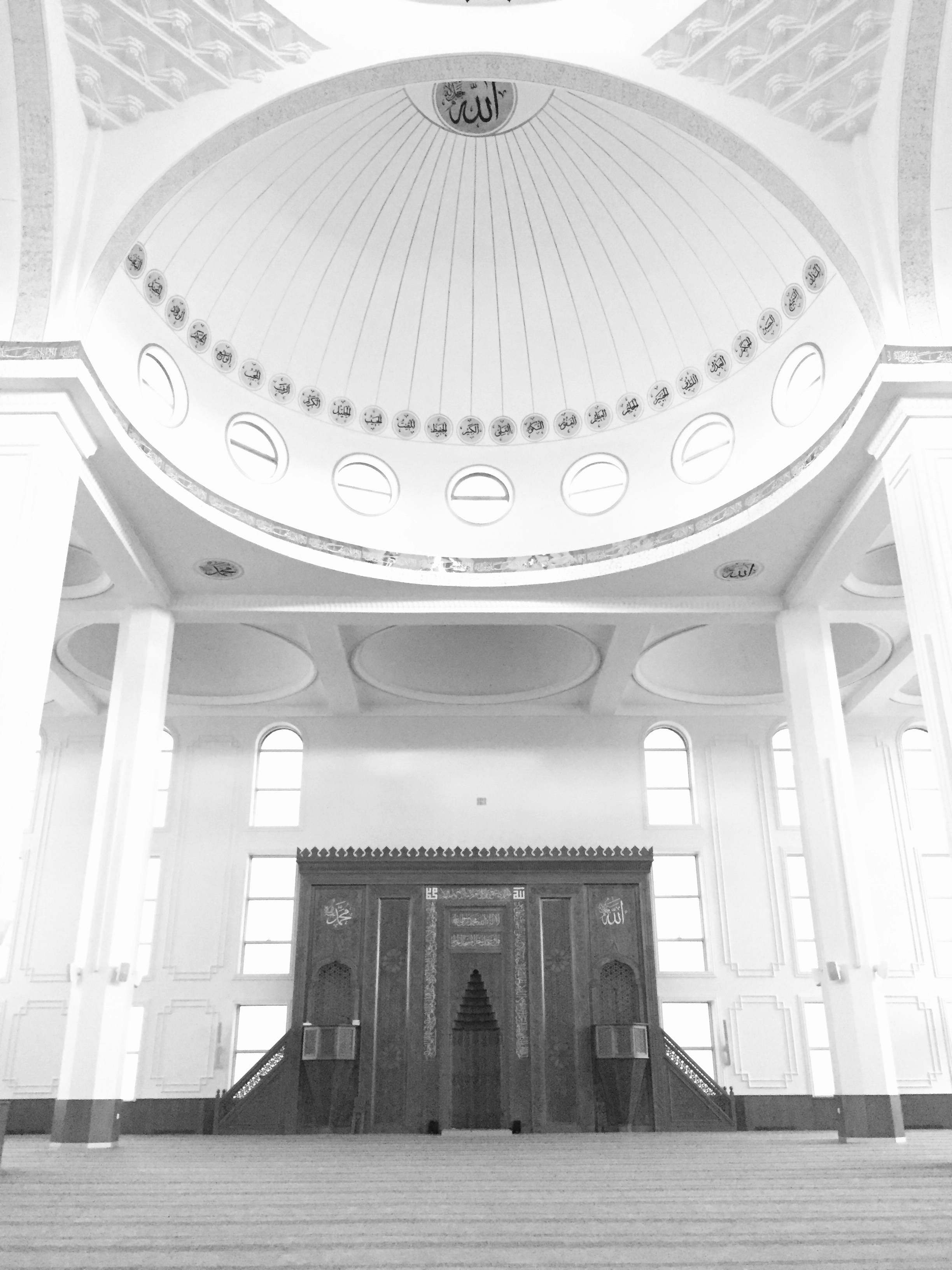 A black and white photo of a large building