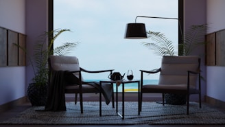A living room with two chairs and a table