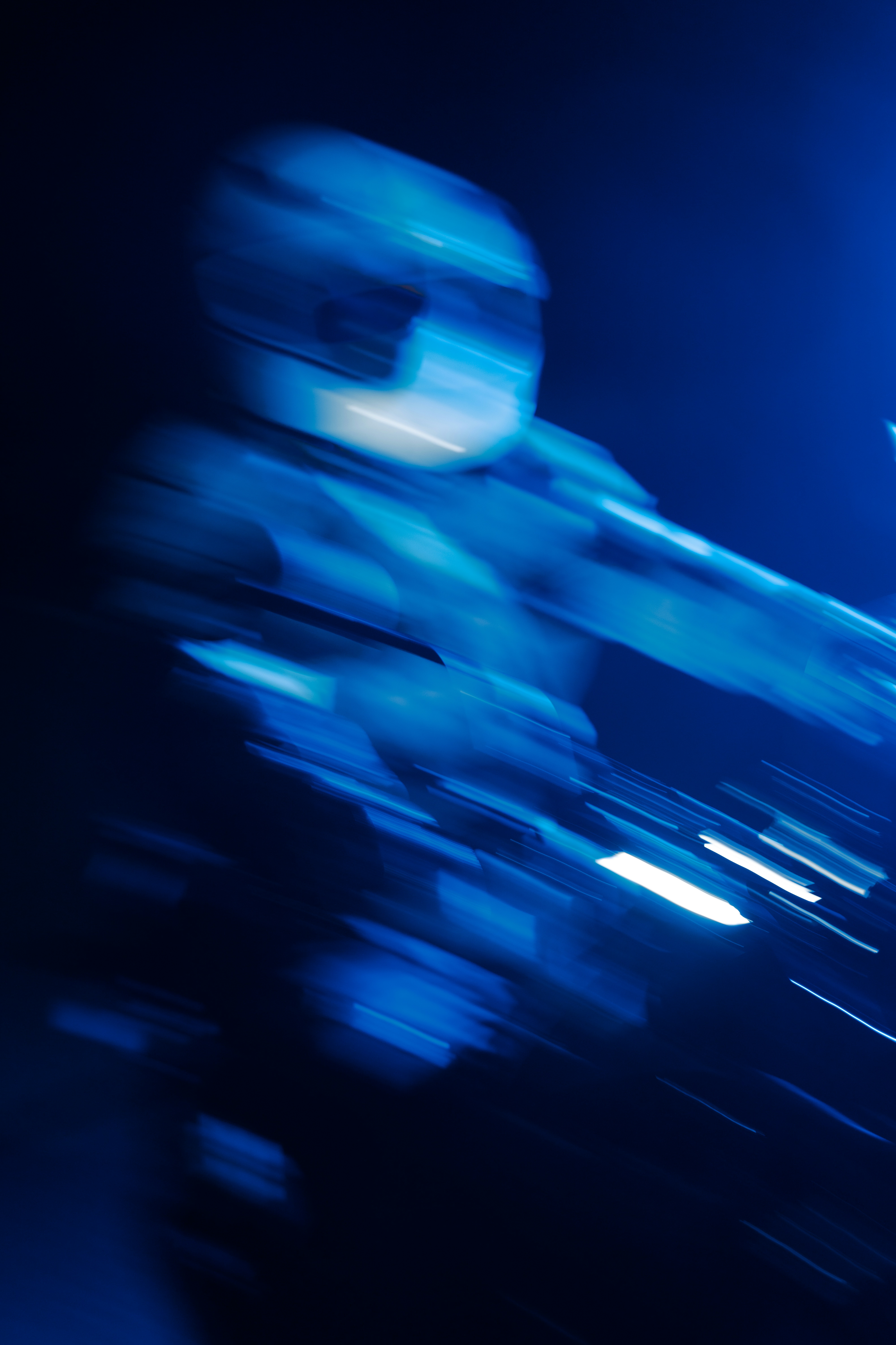 A blurry photo of a person on a motorcycle