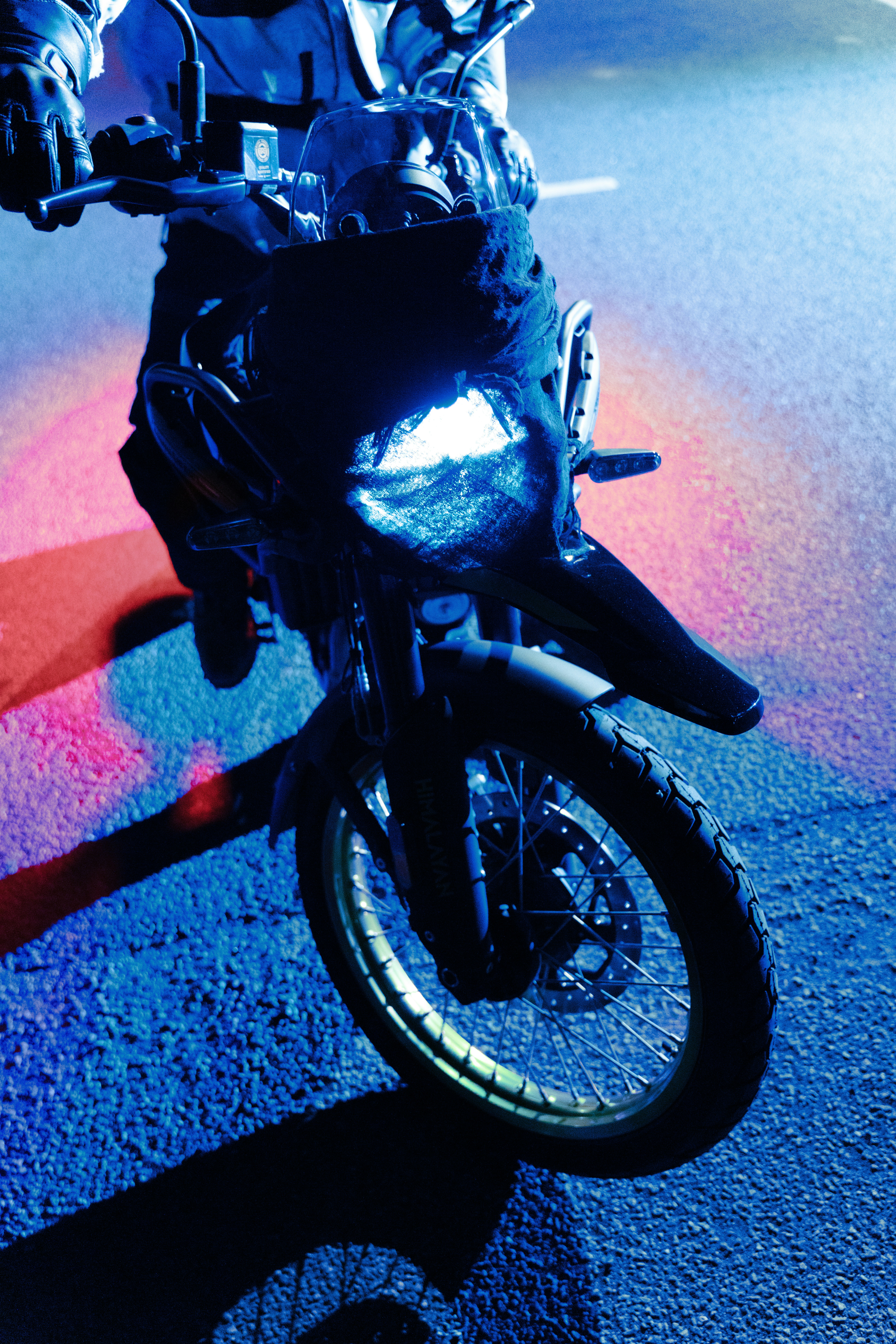 A person riding a motorcycle on a city street