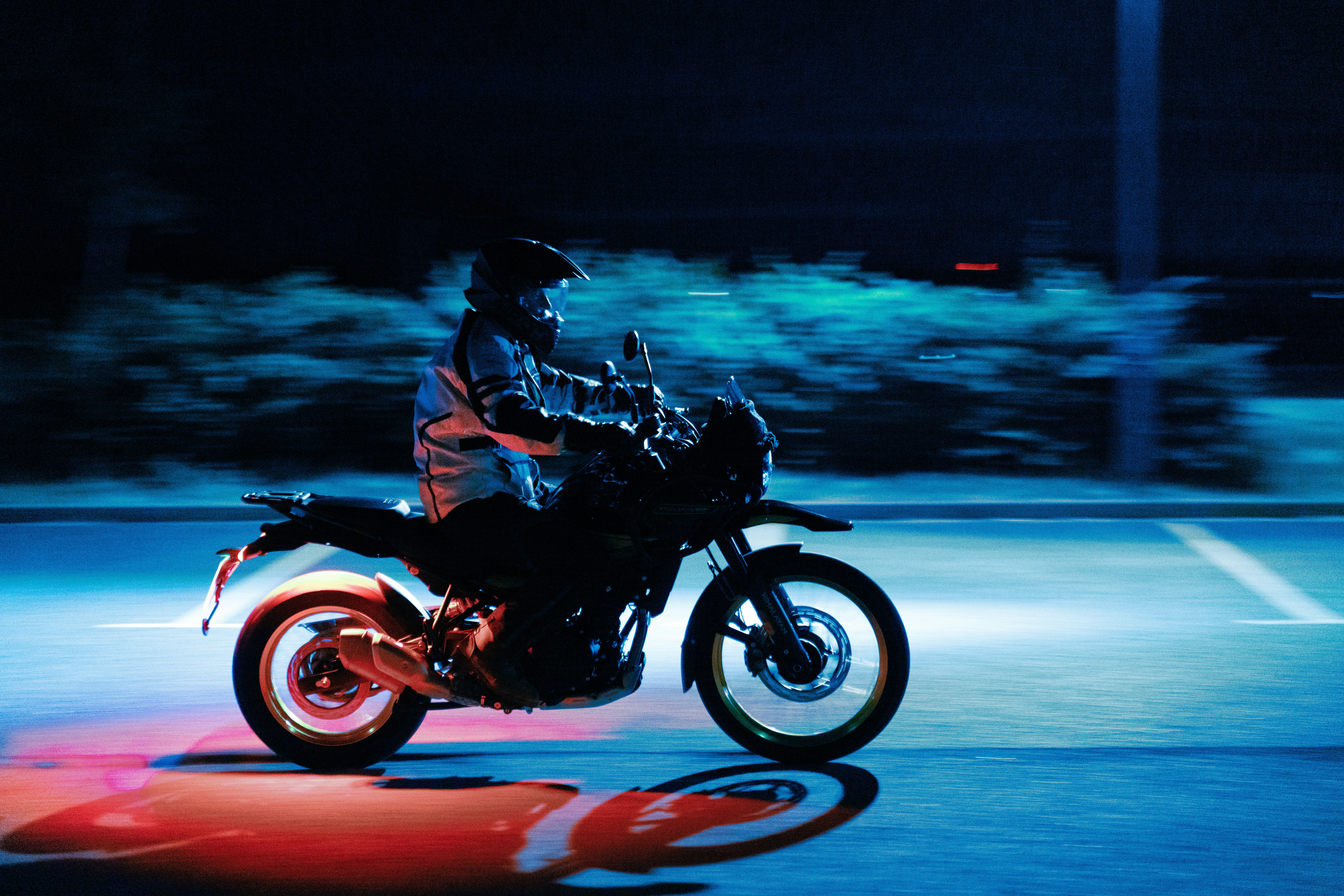 A person riding a motorcycle on a city street