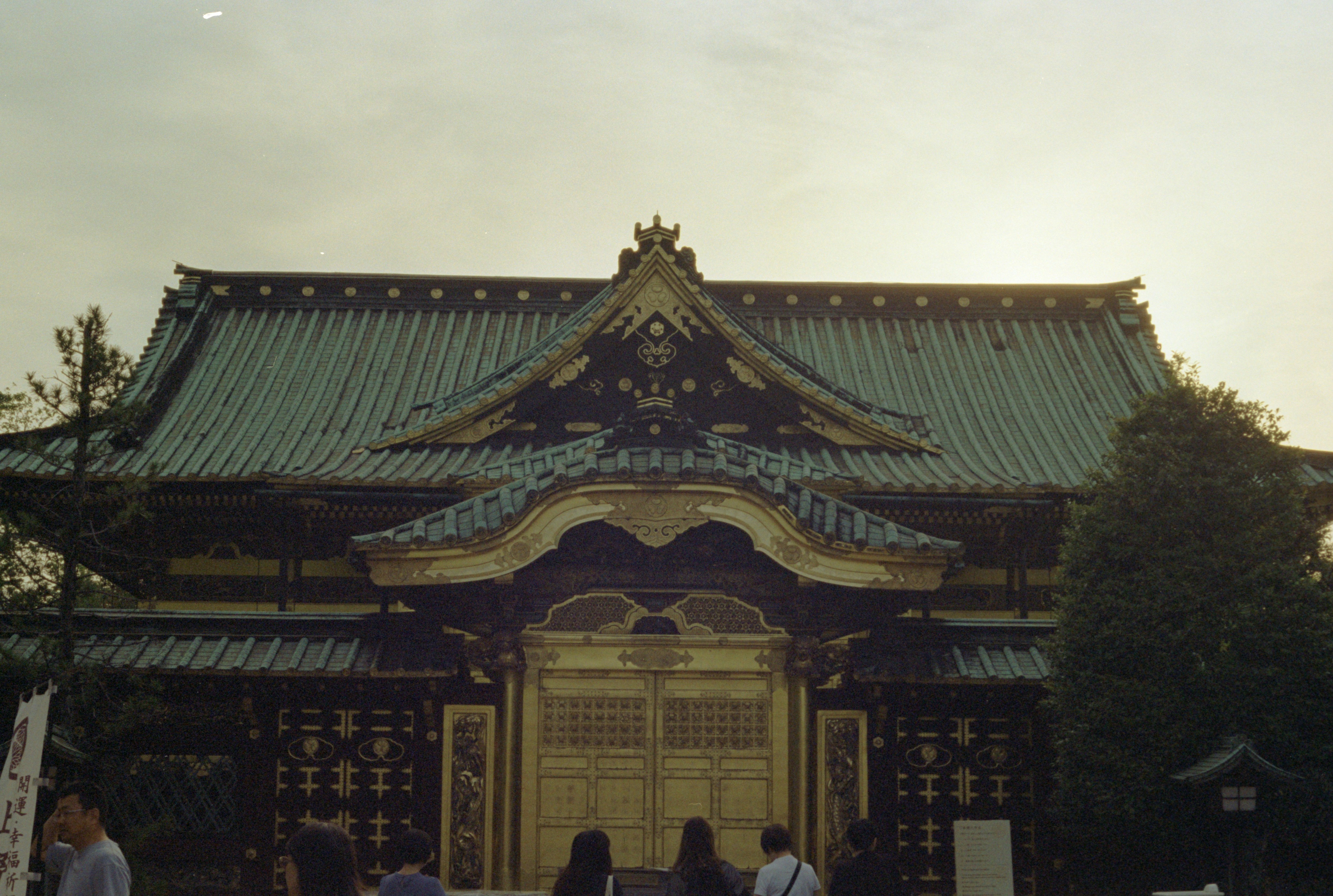 A group of people standing in front of a building