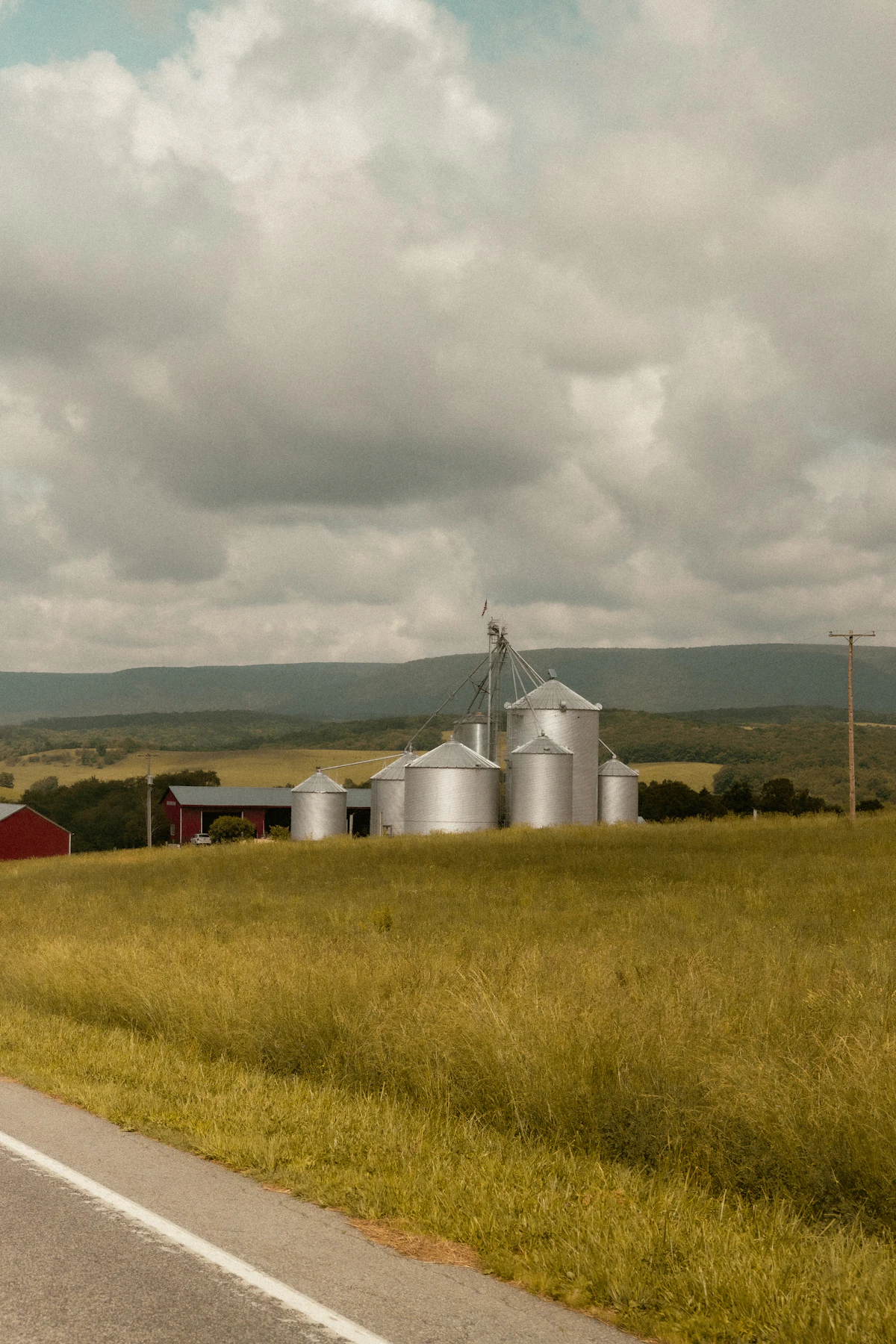 Red barn beside a country road