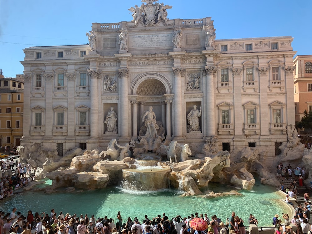The Trevi Fountain in Rome, bustling with tourists