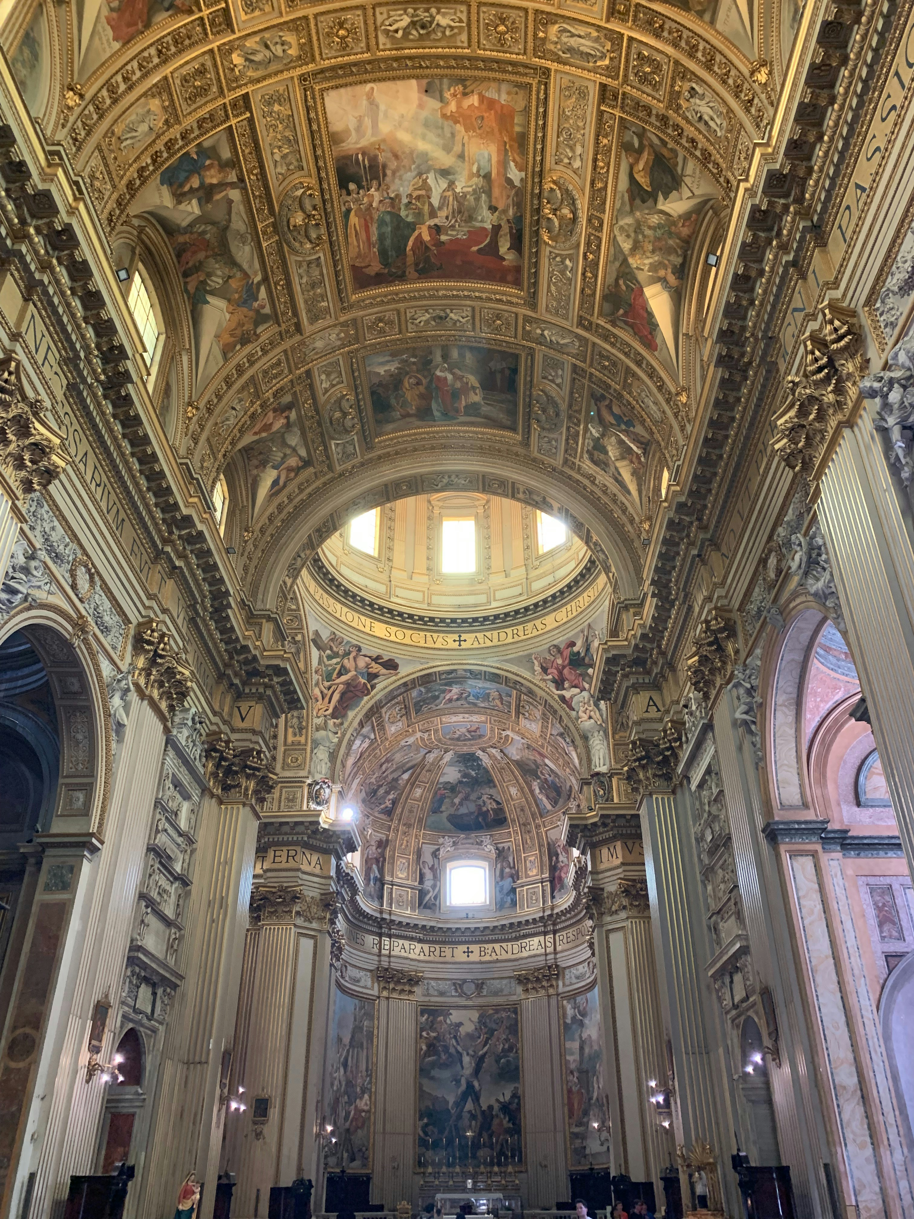 A large cathedral with a painting on the ceiling