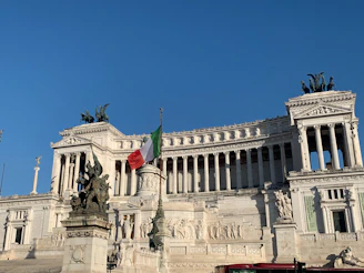 A large building with a statue in front of it