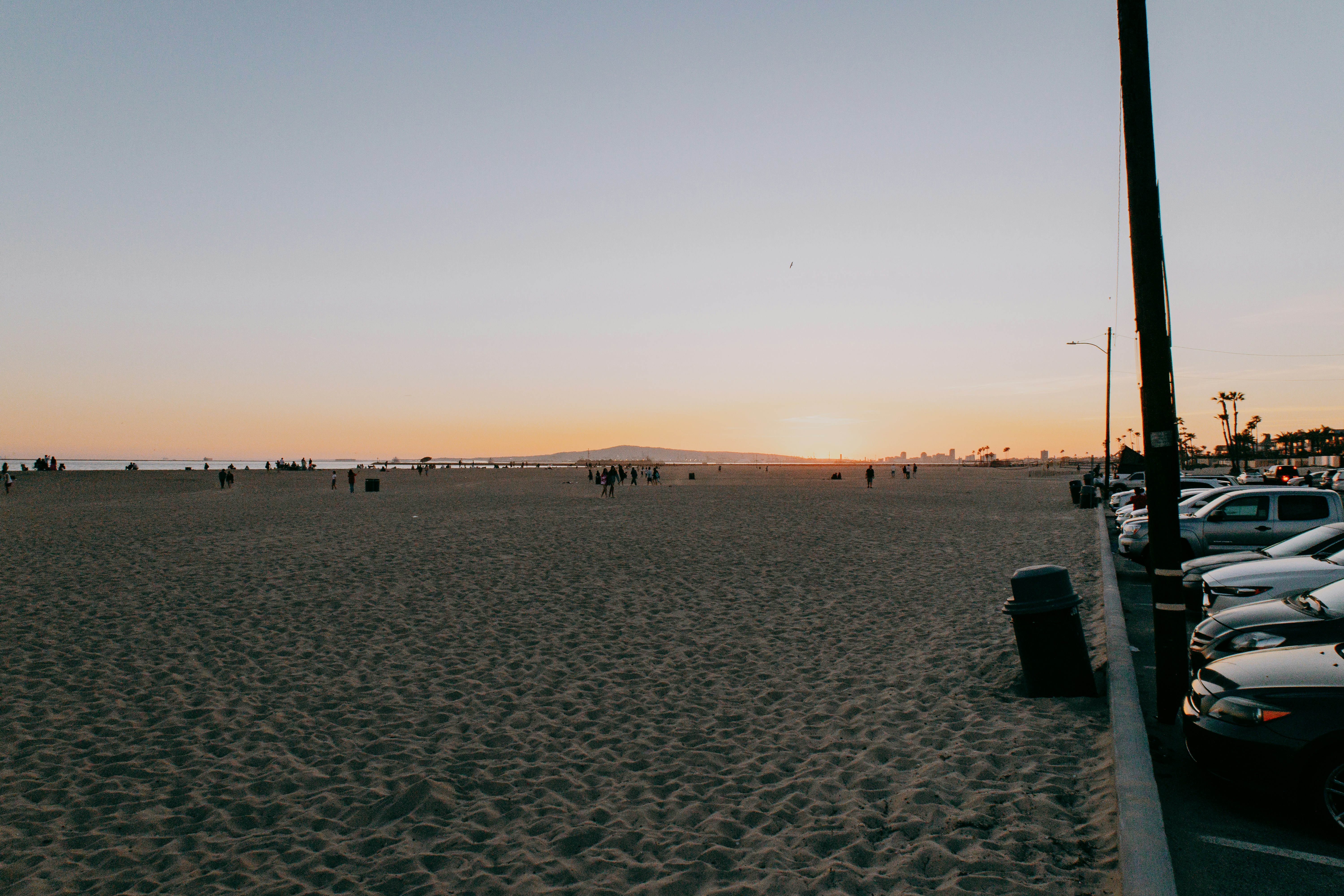 A parking lot filled with lots of parked cars