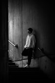 A man standing on the stairs of a building