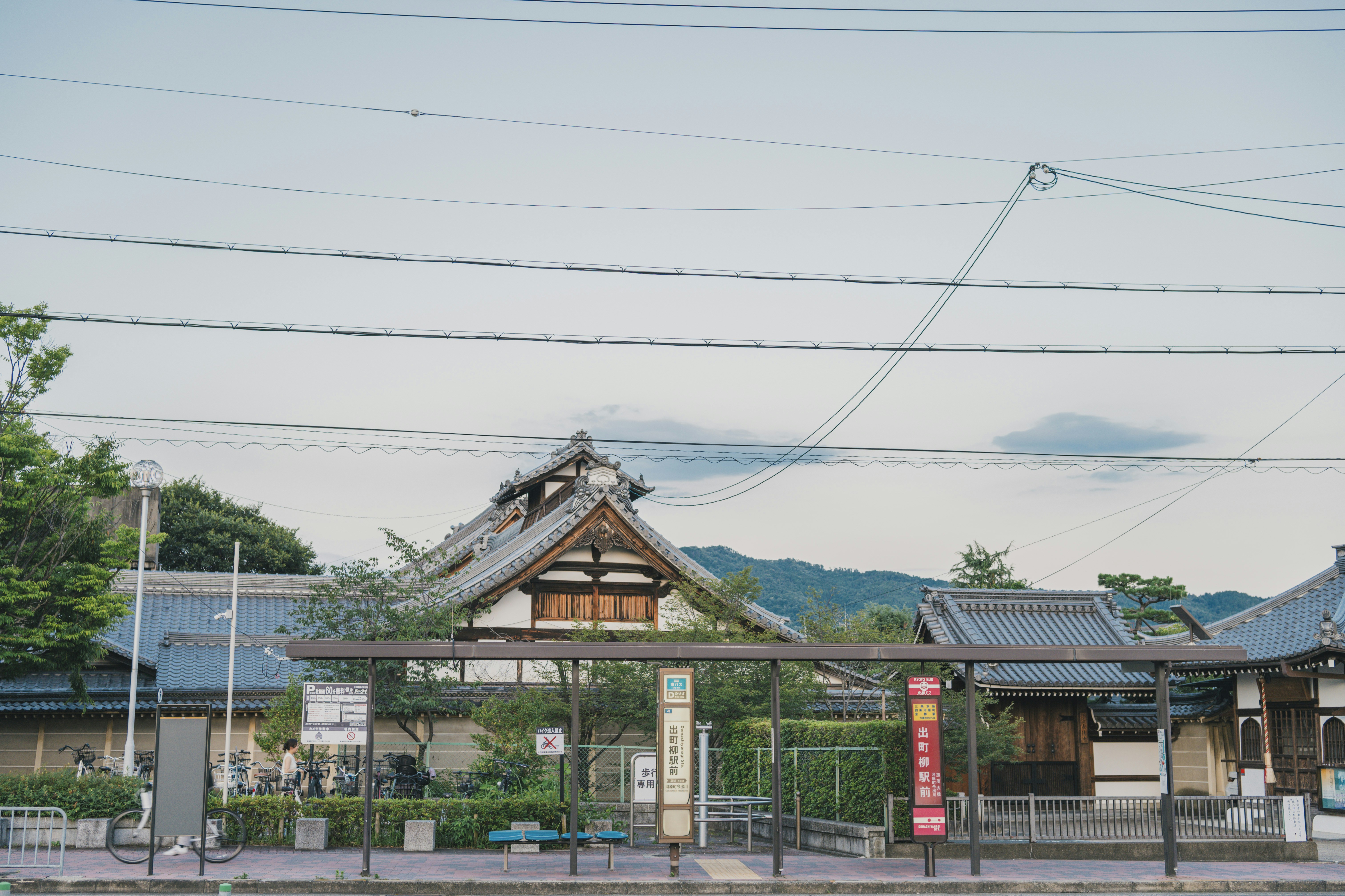 A building with a fence around it near a body of water