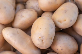 A pile of potatoes sitting next to each other