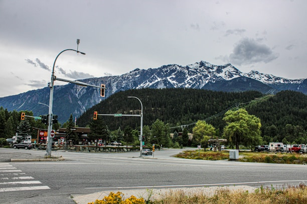 A view of a street with a mountain in the background