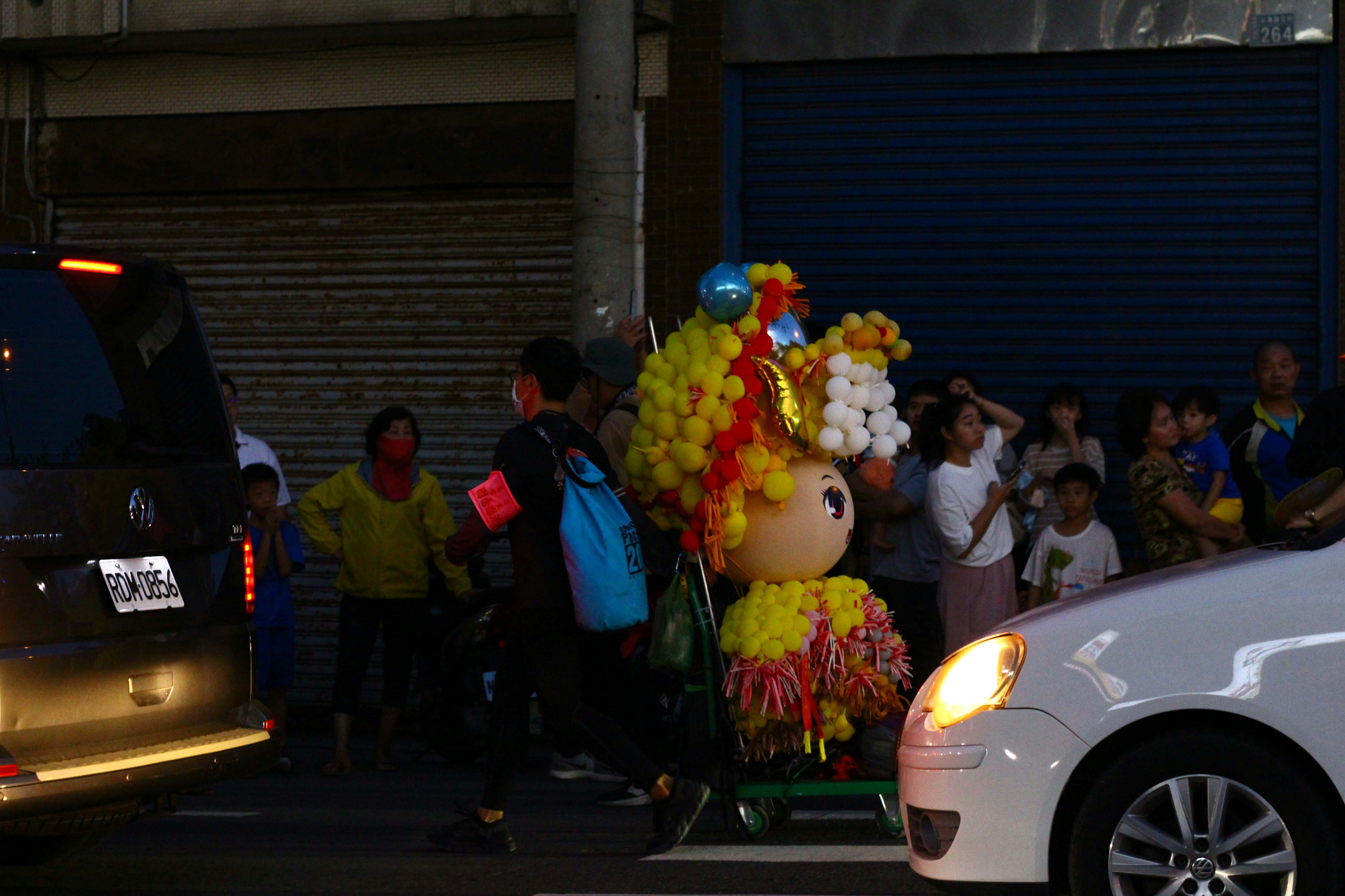 A parade float in the middle of a city street