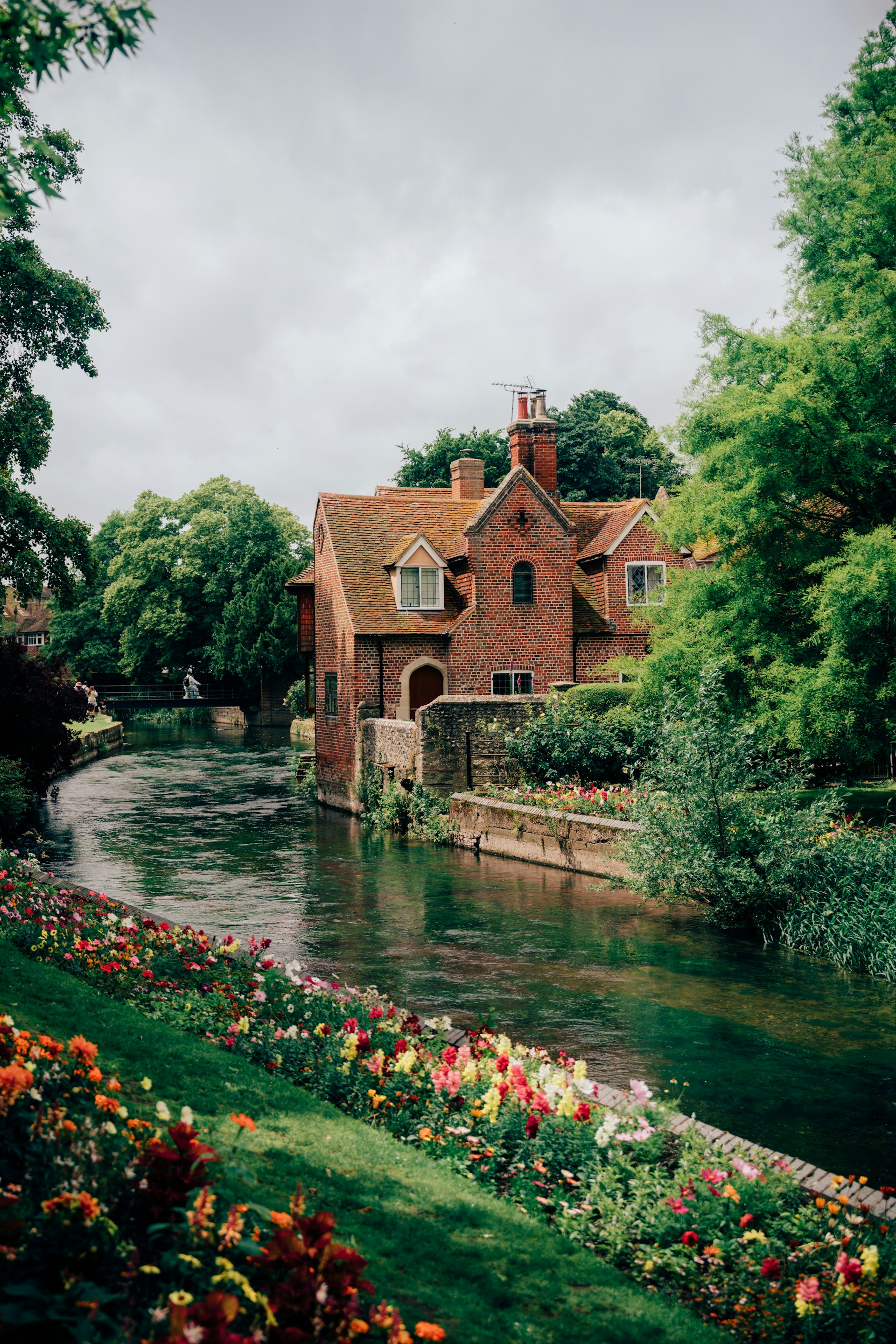 A river running through a lush green park