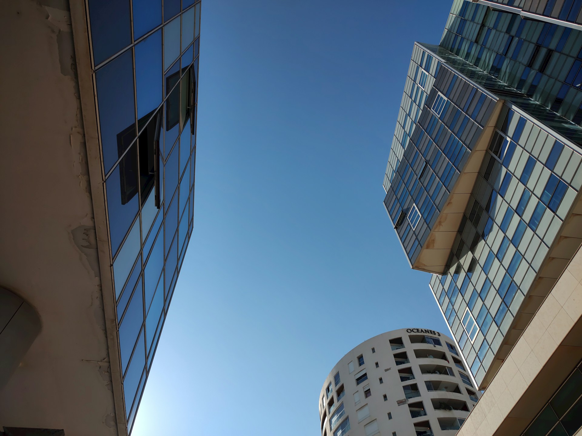 Looking up at a tall building in a city