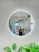 A man taking a picture of himself in a mirror