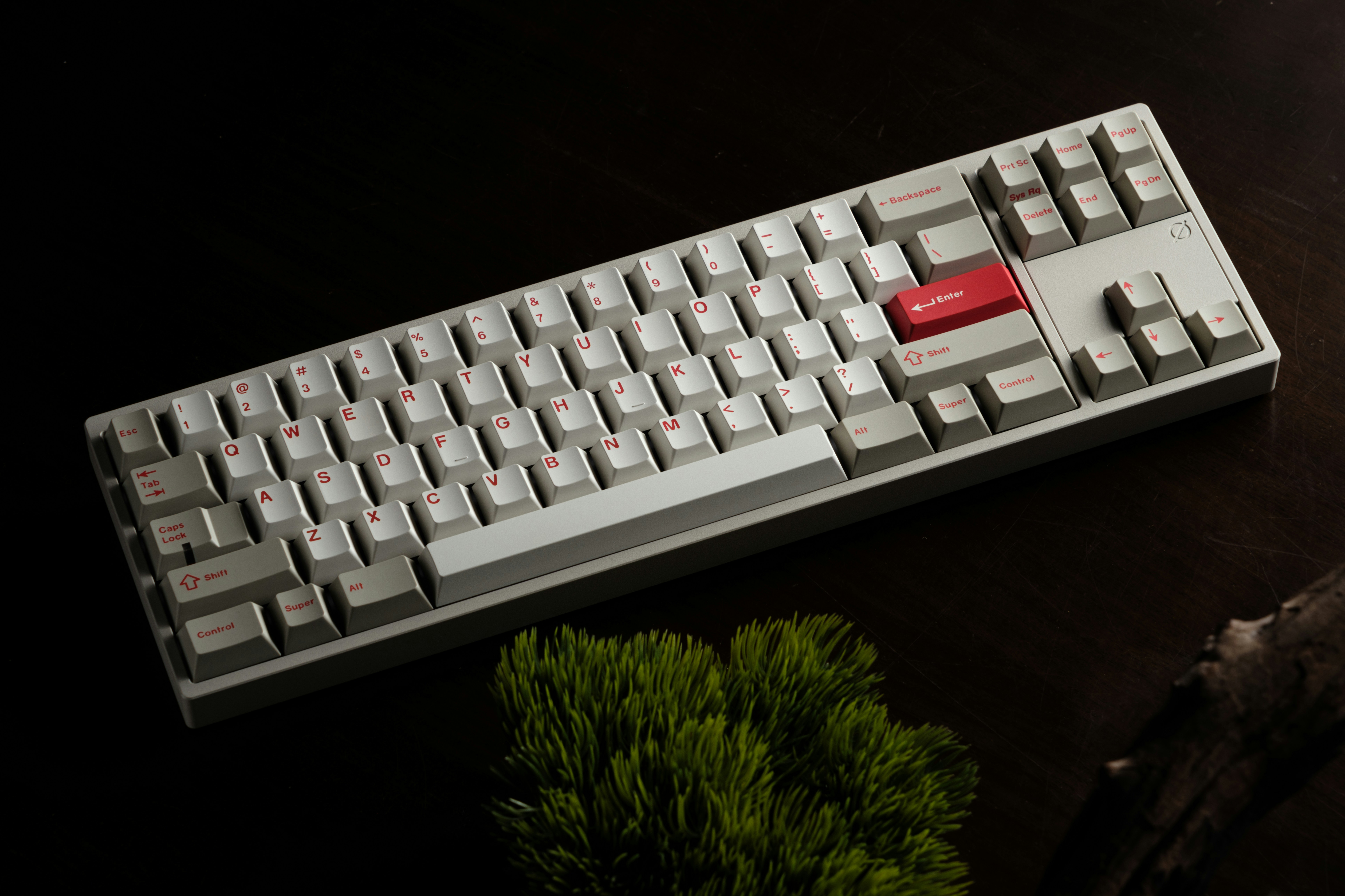 A computer keyboard sitting on top of a table
