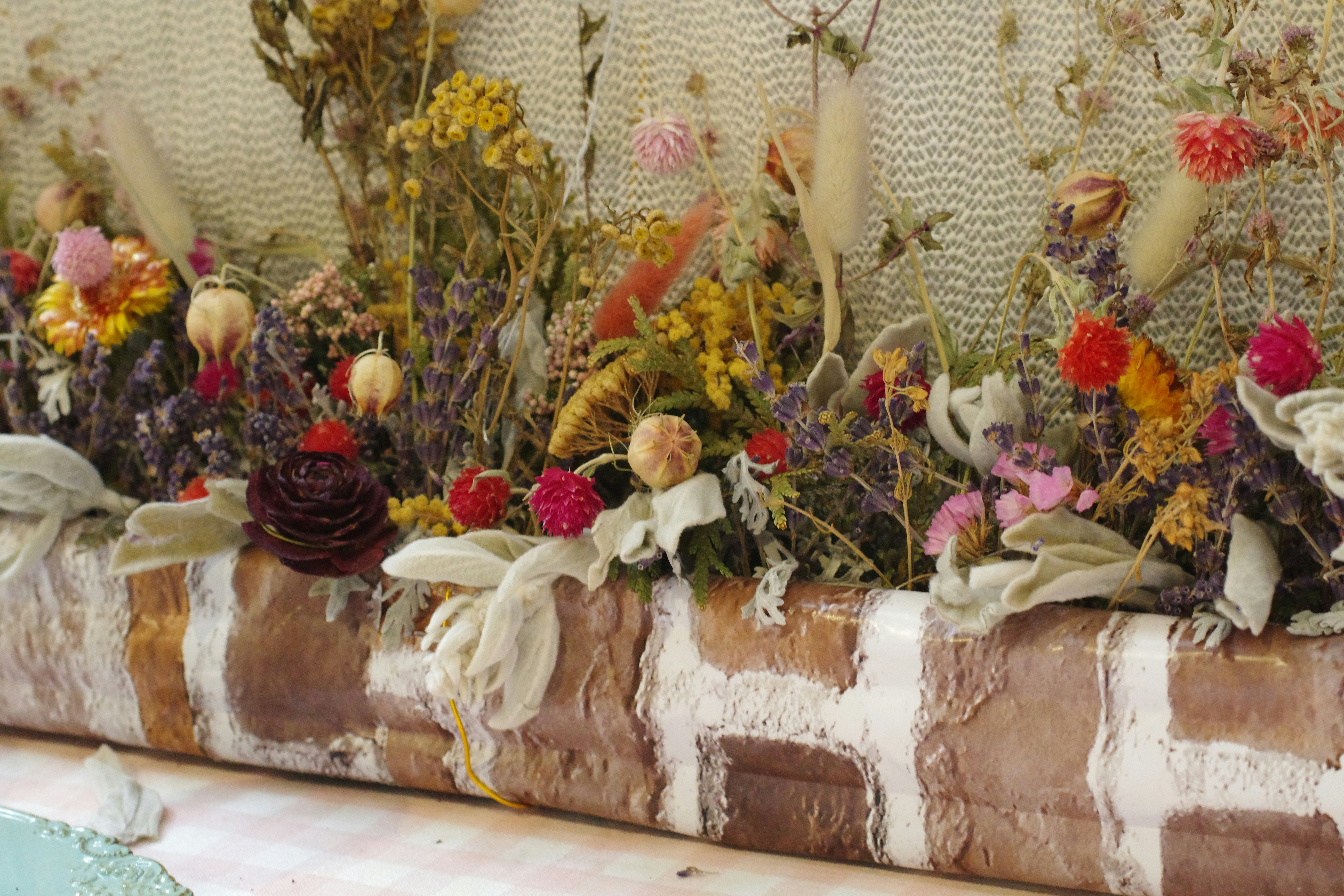 Cedar raised garden bed filled with vegetables and flowers