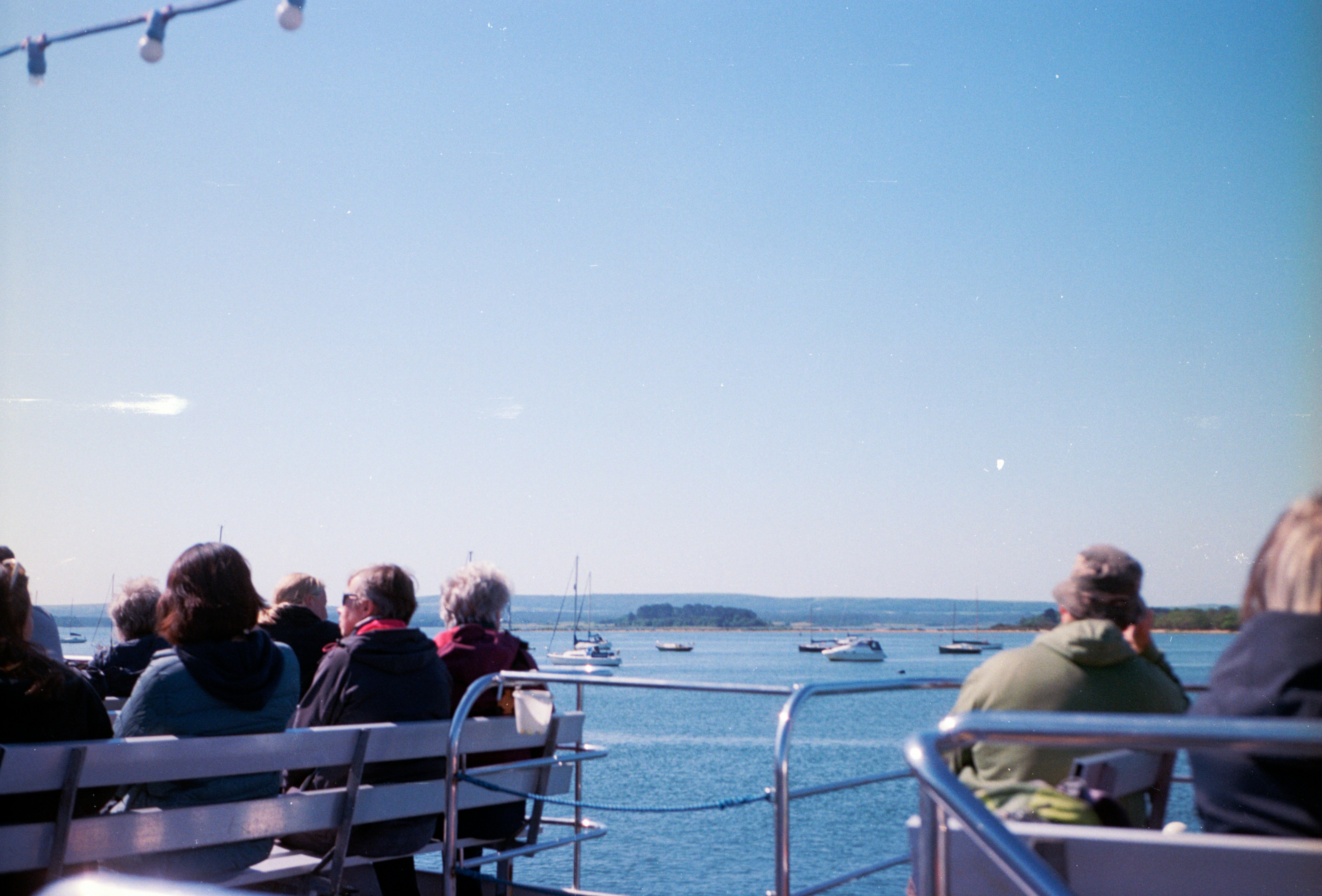 A group of people sitting on top of a boat