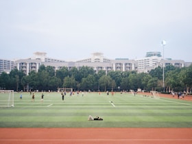A group of people playing a game of soccer