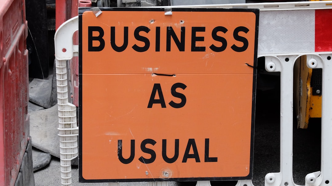A sign that says business as usual on it,