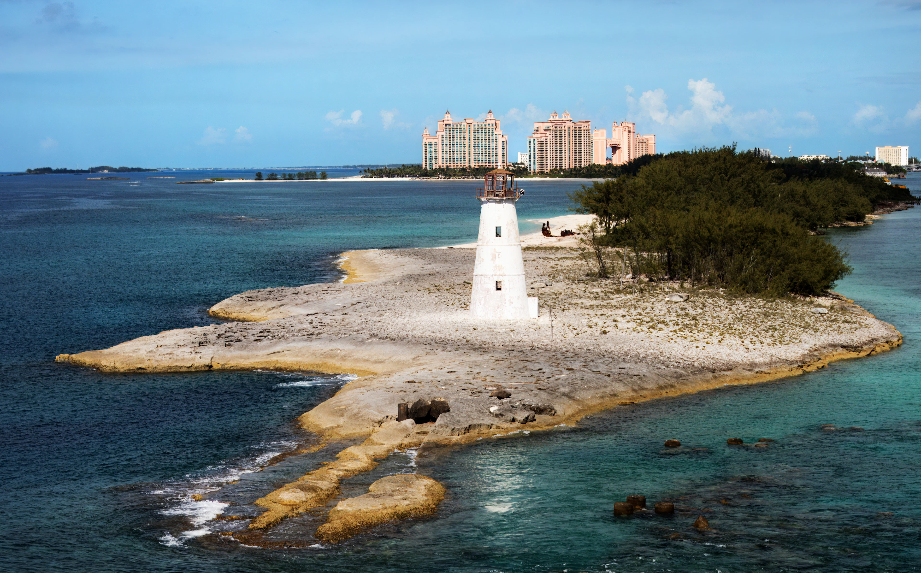A lighthouse on a rocky islet in the open sea