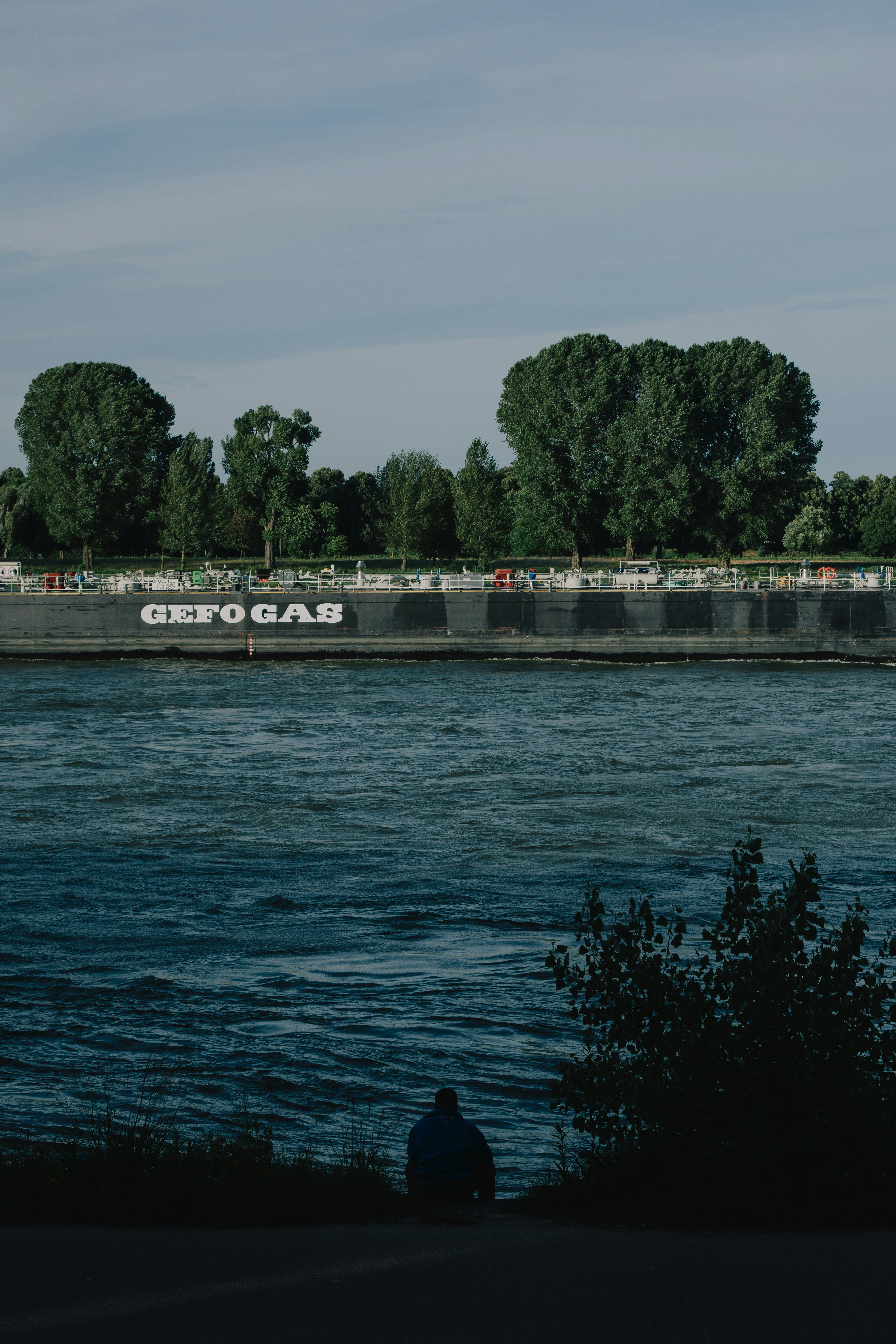 A large barge floating on top of a body of water photo – Free Grey ...