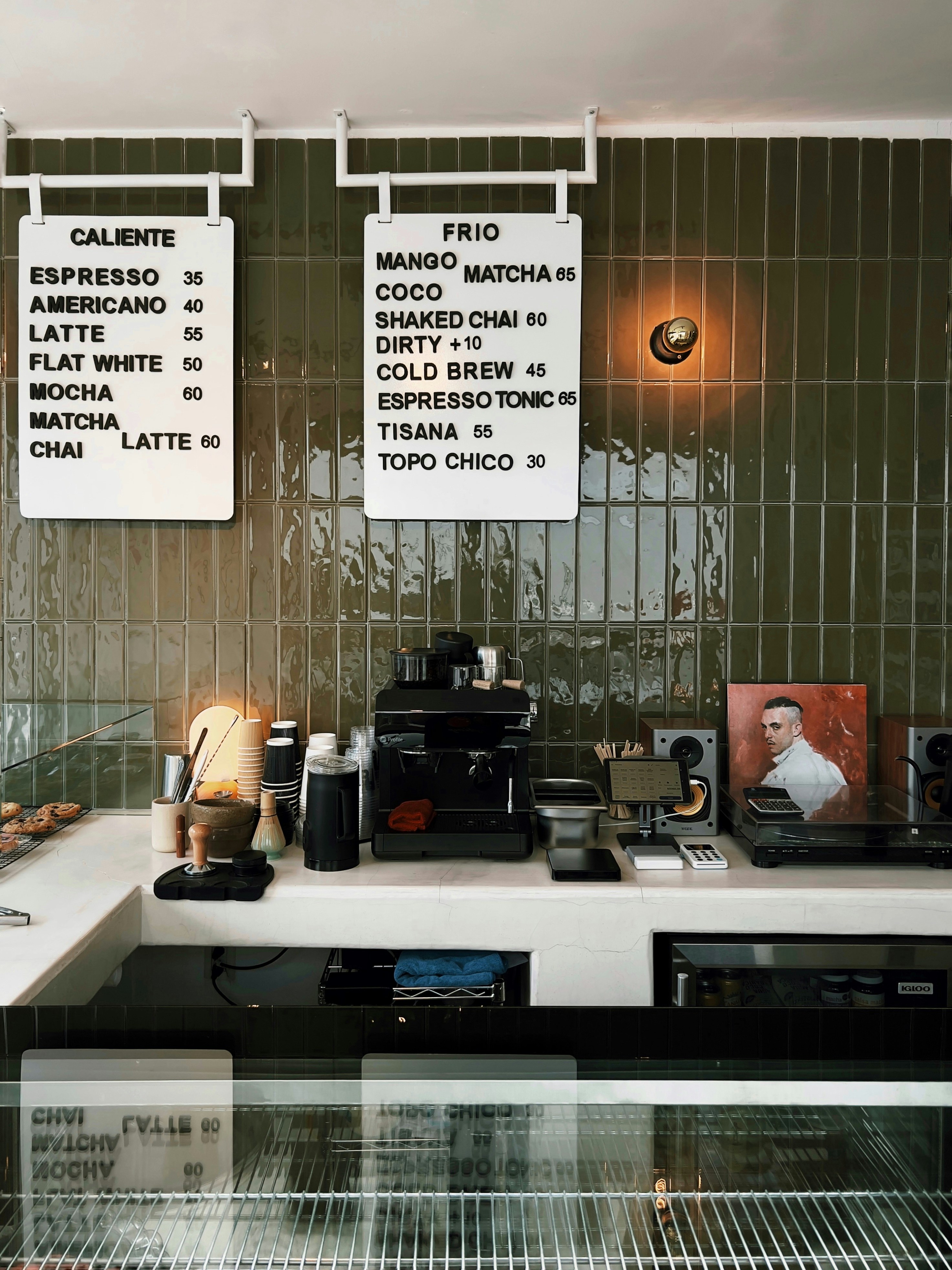 A coffee shop with a lot of signs on the wall