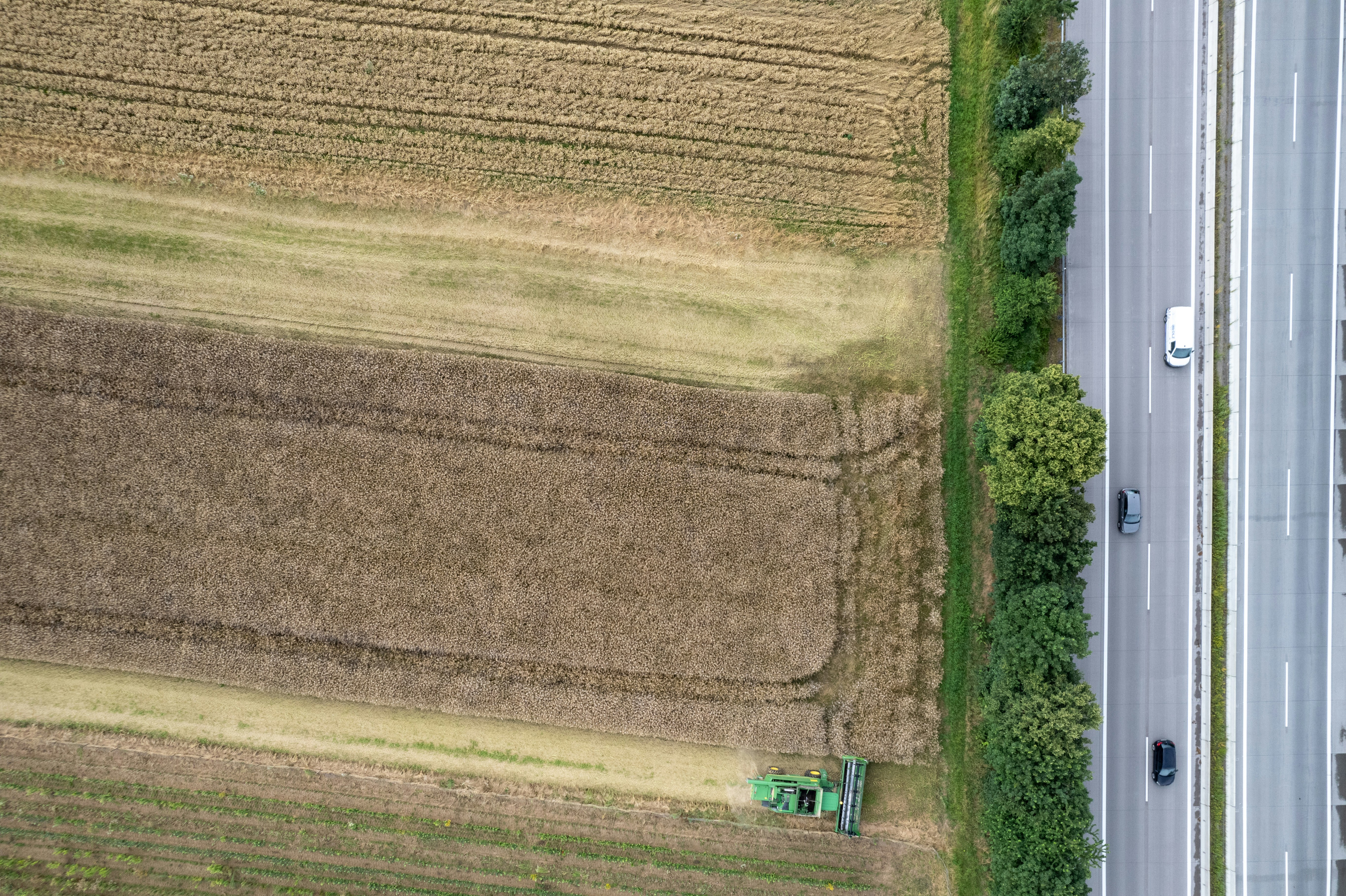 An aerial view of a road and a field