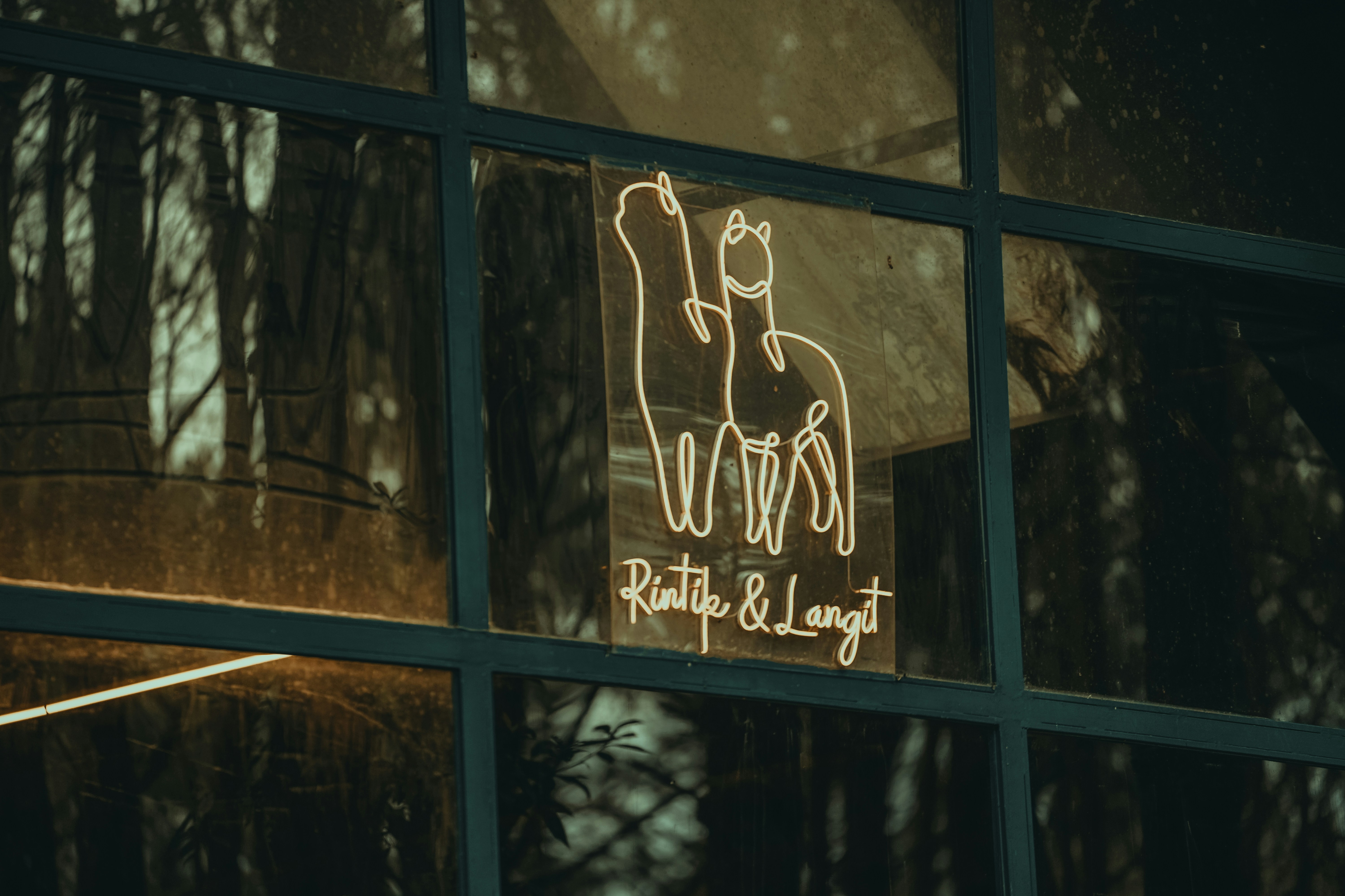 The reflection of a building in a window