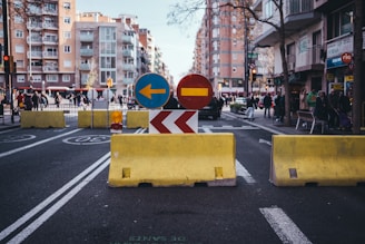 A street that has a yellow barricade on it