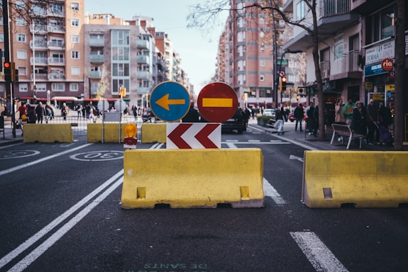 A street that has a yellow barricade on it