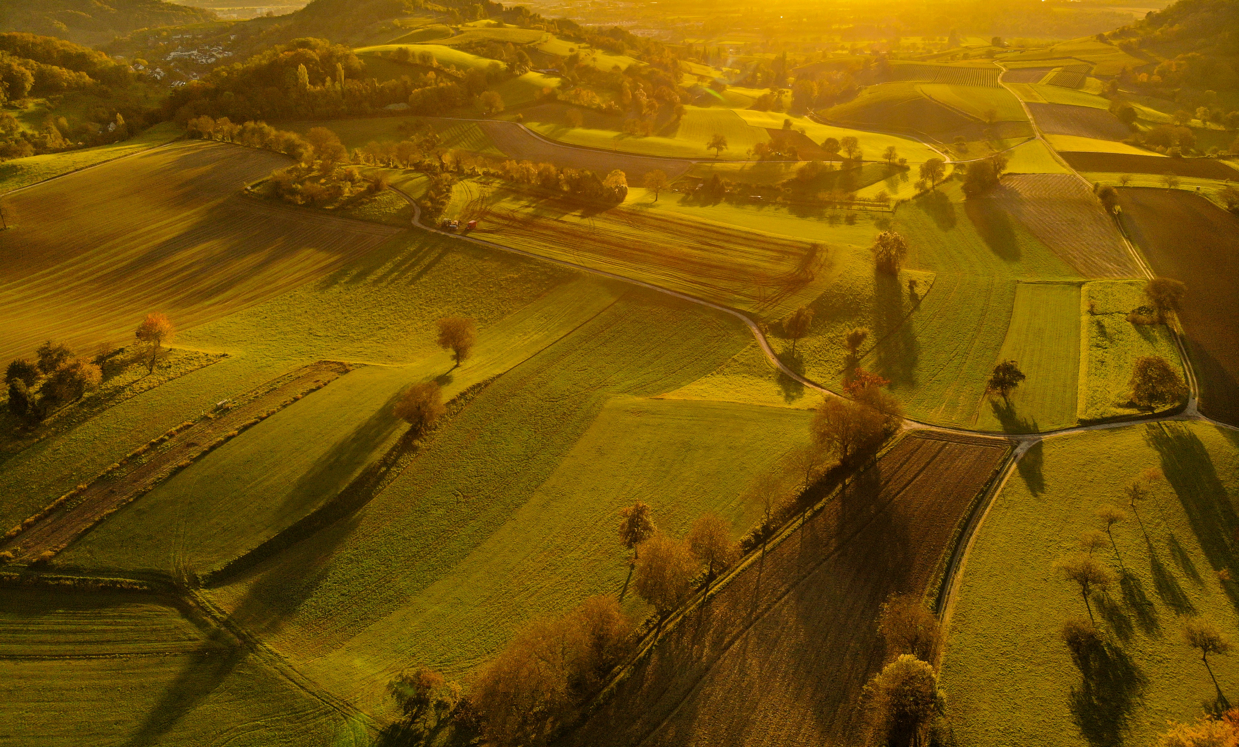 An aerial view of a rural countryside at sunset