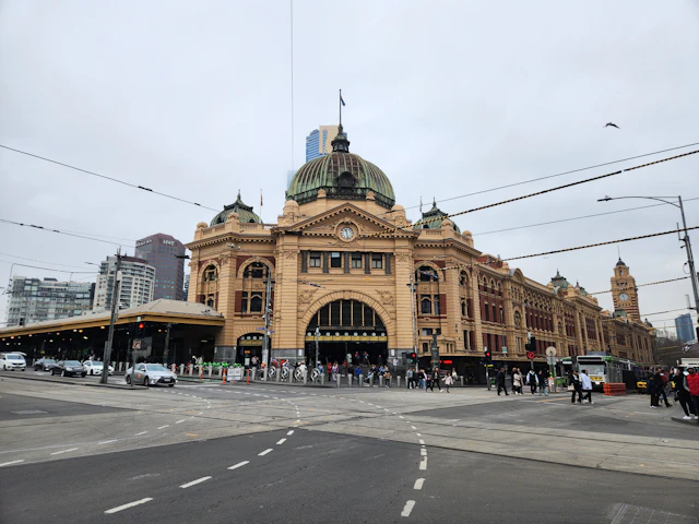 Melbourne’s Flinders Street Station with its green dome, entrance clocks and yellow facade