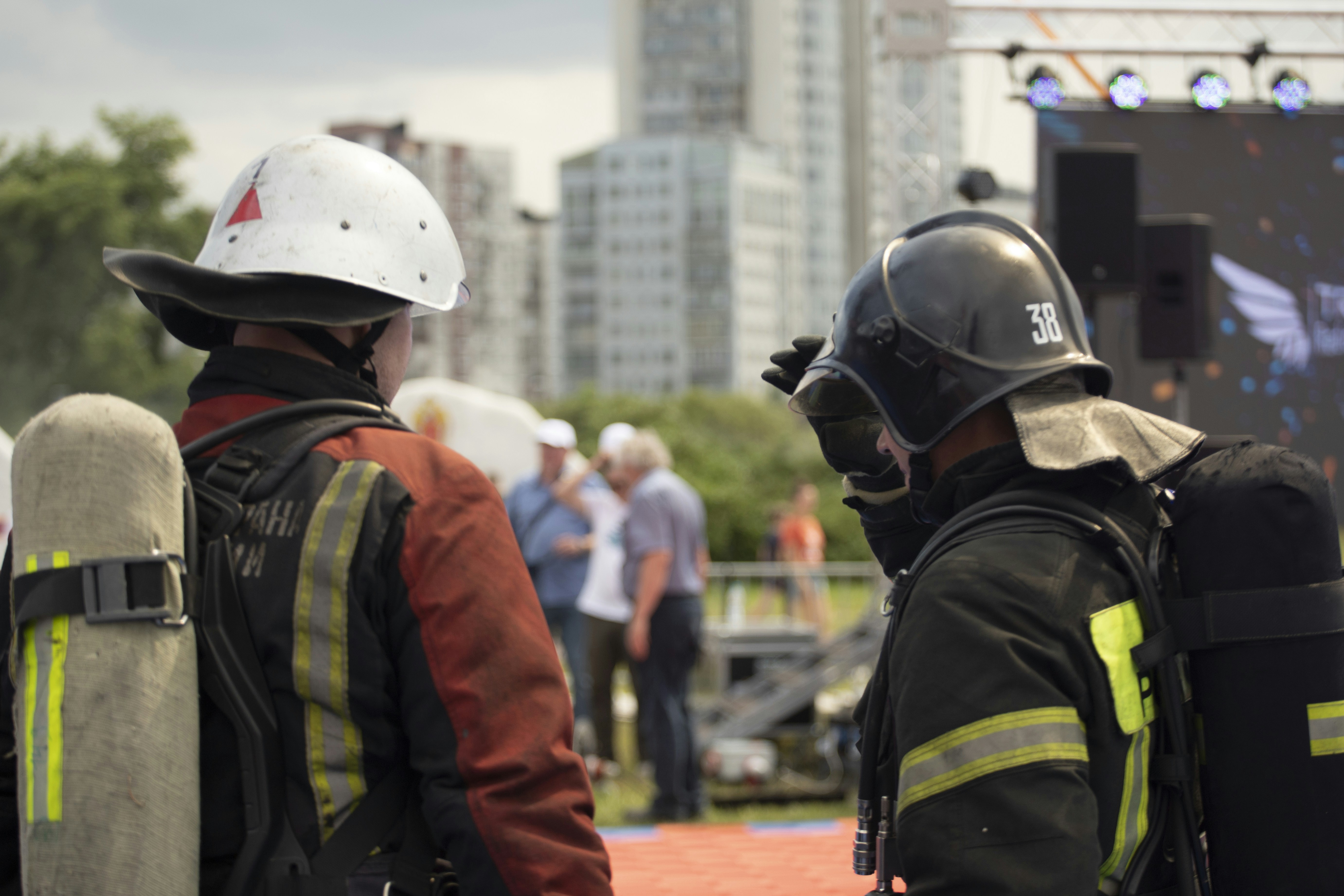 A team of firefighters competing in a hose laying drill.